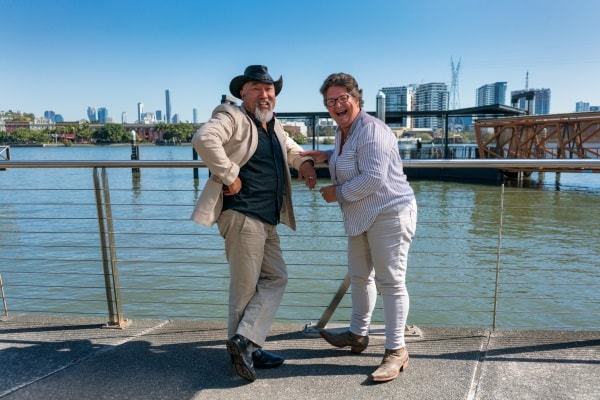 old couple laughing near water